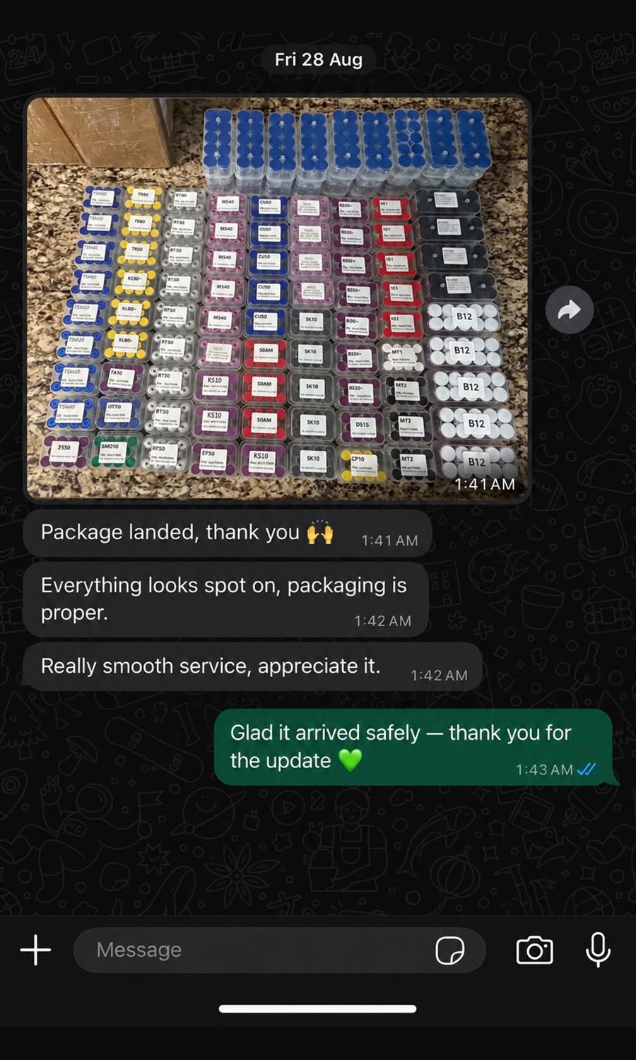 WhatsApp message dated 28 August 2026 showing a large NobelPepLab wholesale order packed in shredded paper — roughly 80 labelled vial trays including CU50, SK10, MS40 and B12. The customer writes that the package landed, the packaging is proper and the service was really smooth.